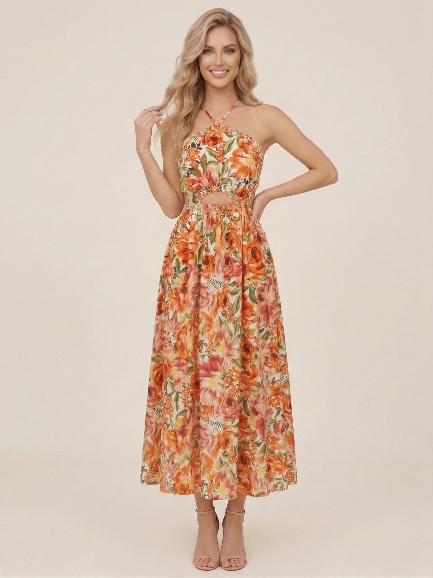 Robe femme imprimée à fines bretelles croisées, taille découpée, jupe midi évasée, style chic romantique et féminin.
