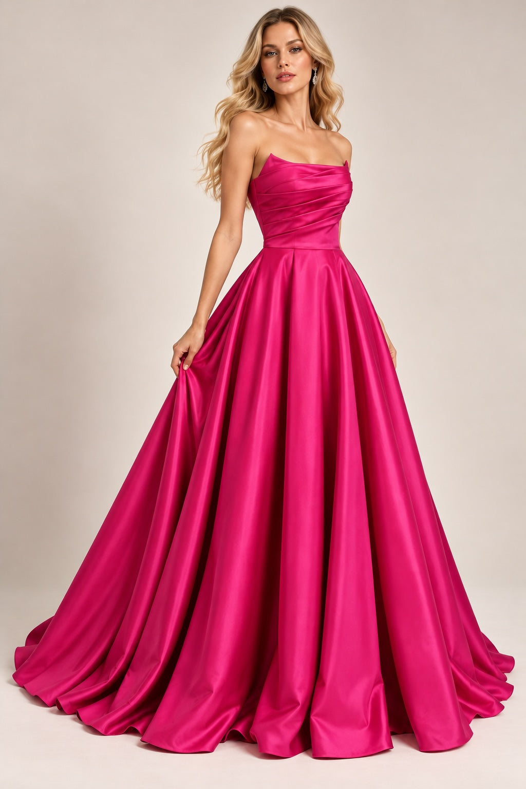 Robe de soirée bustier satinée fuchsia avec drapé structuré, jupe volumineuse et fente élégante, par Dressie Dress.