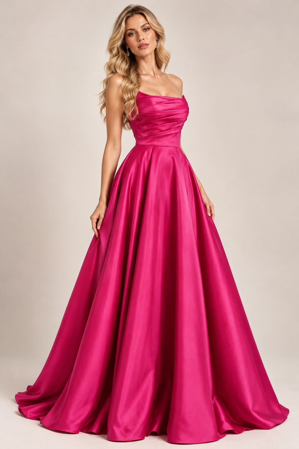 Robe de soirée bustier satinée fuchsia avec drapé structuré, jupe volumineuse et fente élégante, par Dressie Dress.