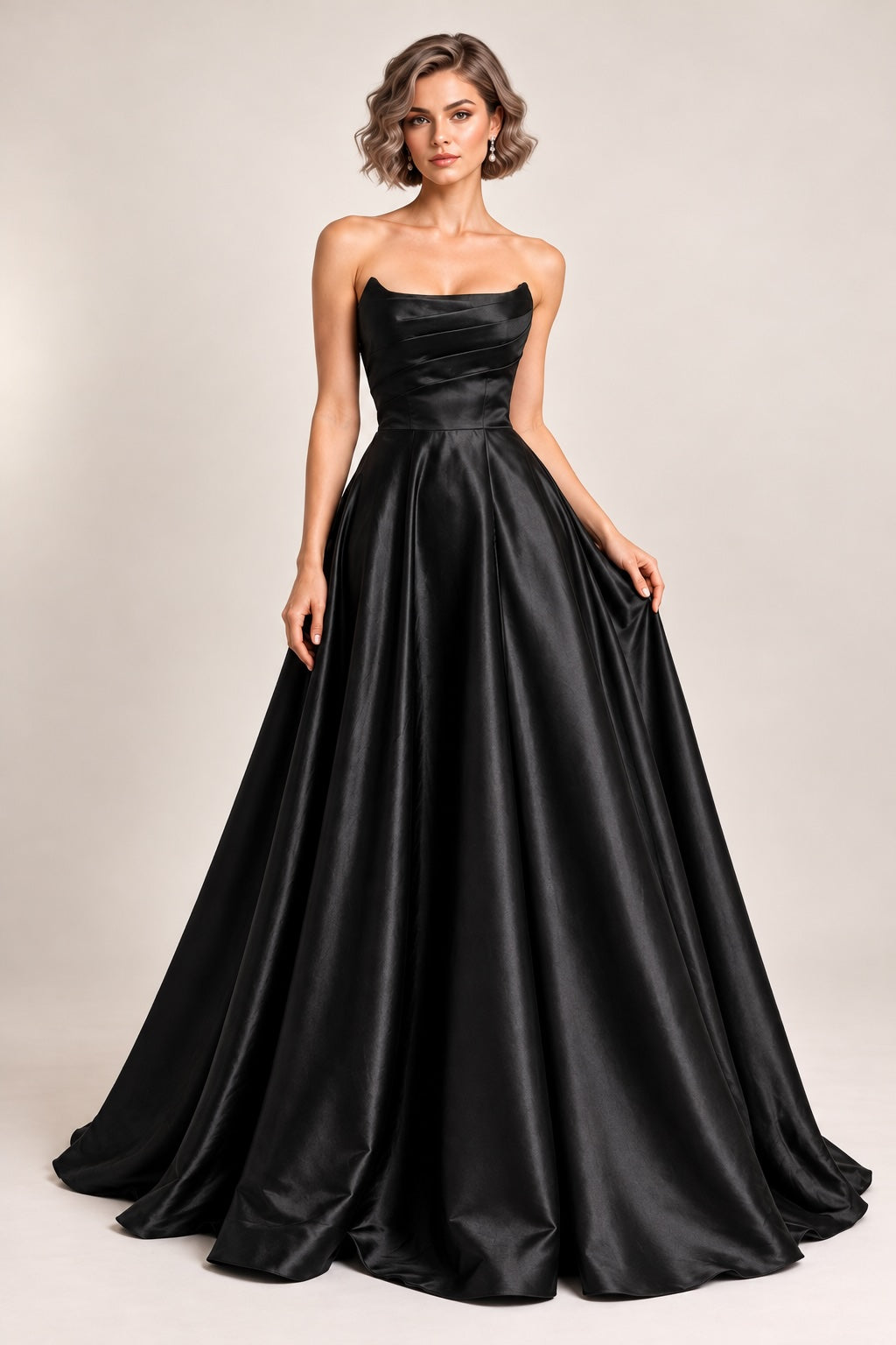 Robe de soirée bustier satinée noire avec jupe volumineuse, drapé structuré et fente élégante, par Dressie Dress.